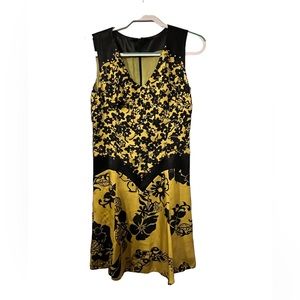 A-line silk or satin party dress. Yellow and black.